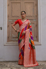 Red saree with Kadwa style weaving and multicolor stripes