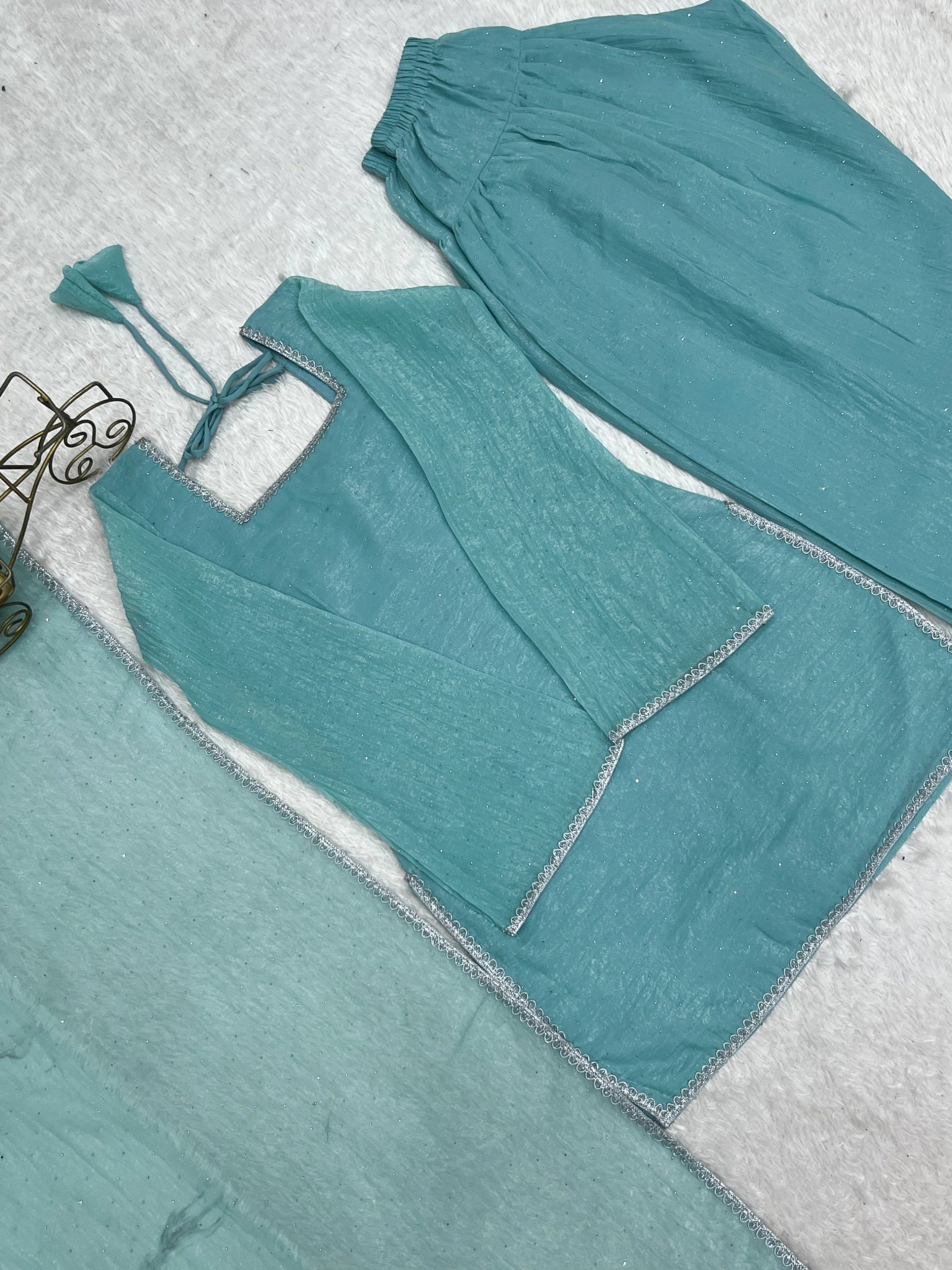 Sky blue suit flat lay - lace border detail