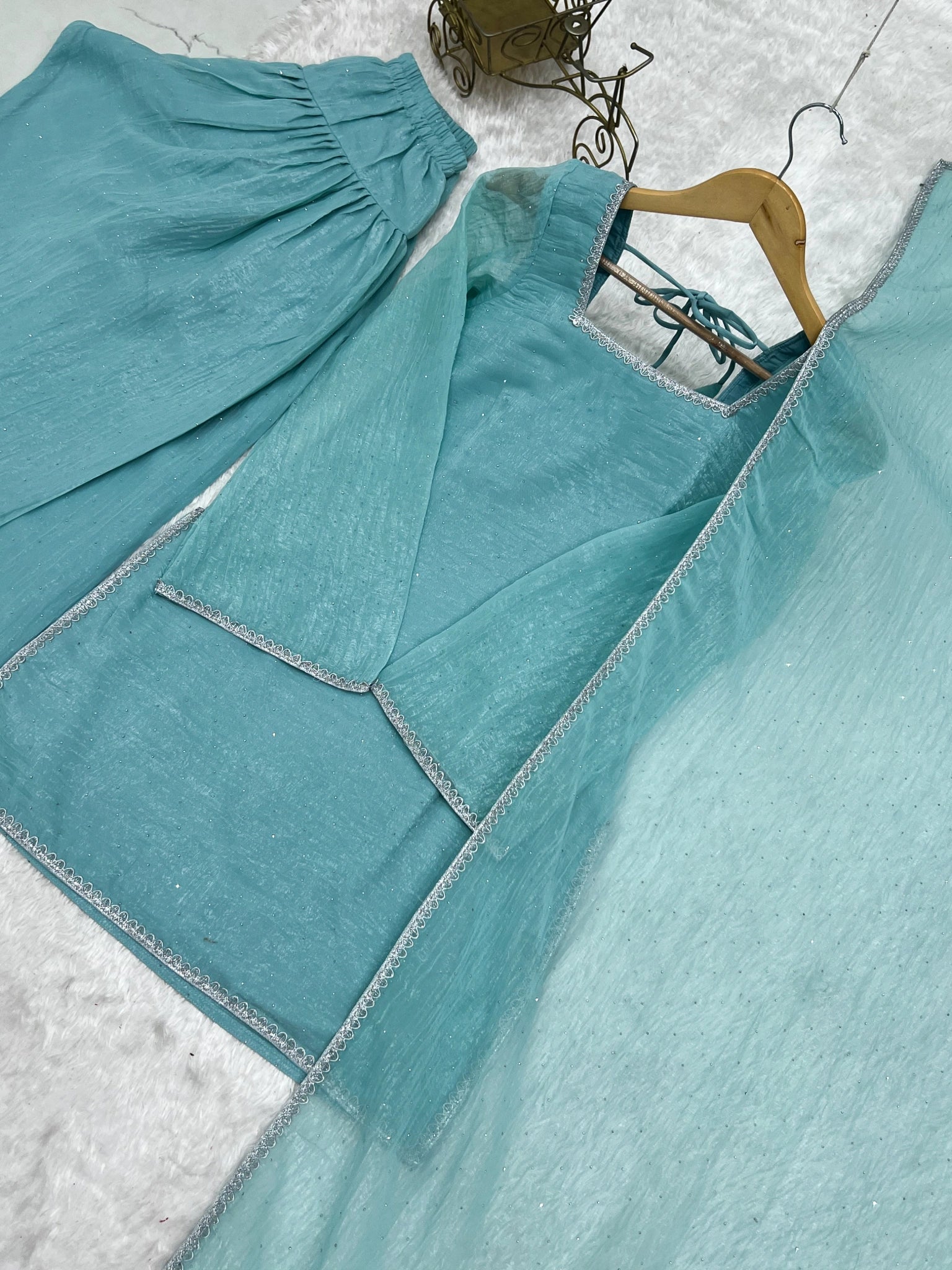 Sky blue suit flat lay - back tie-up detail