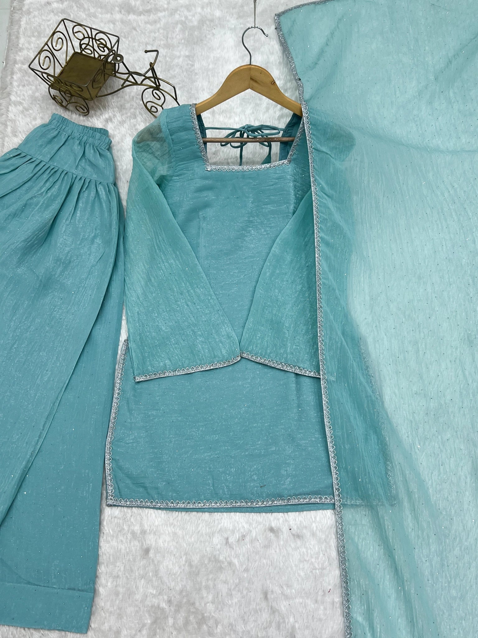 Sky blue suit flat lay - kurta, shalwar and dupatta