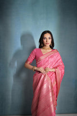 Tulip pink saree featuring intricate ikkat and zari weaving, showcasing traditional handloom textile craftsmanship