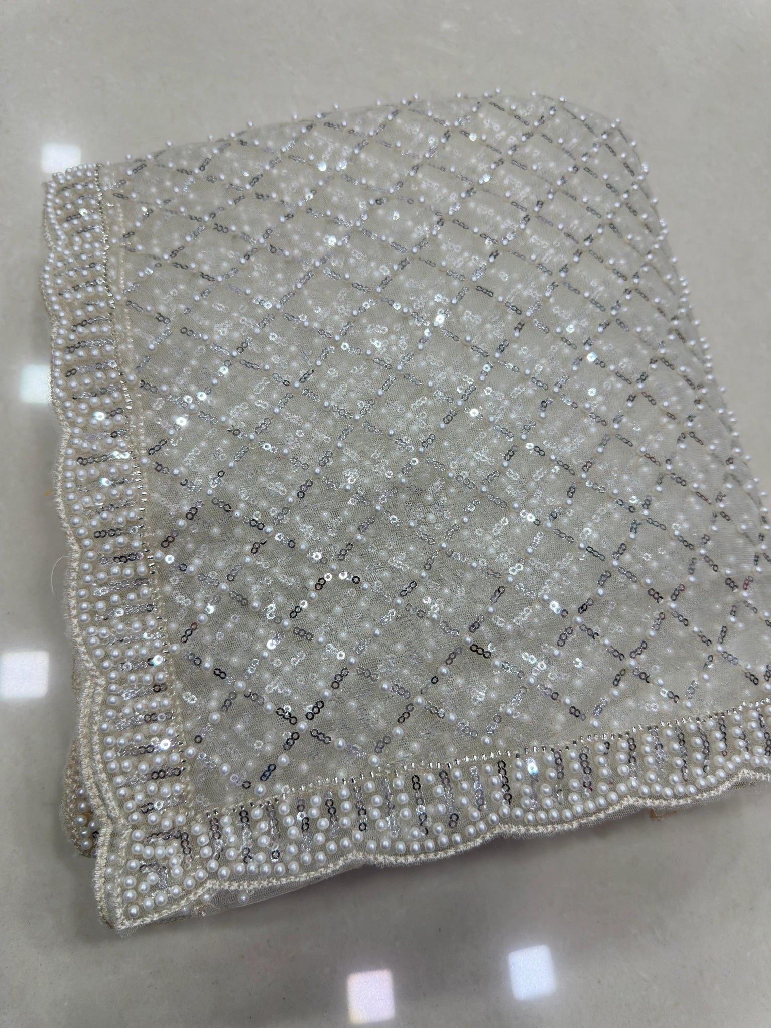 White Sequins Embroidered Saree – fabric flat lay – KS397