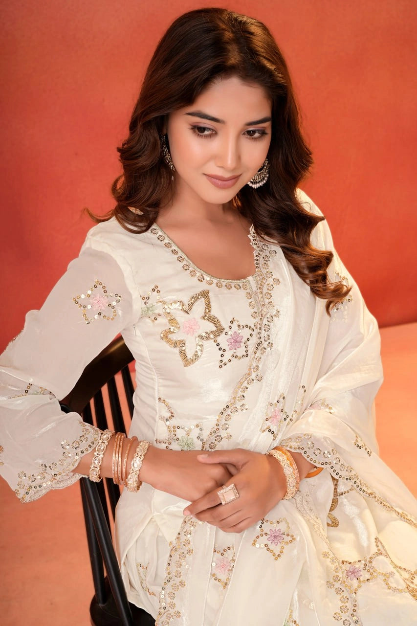 White Sequins Sharara Suit portrait close-up seated showing sequins flower motifs and cuff detail