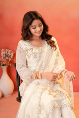 White Sharara Suit seated lifestyle shot showing neckline and upper body embroidery detail