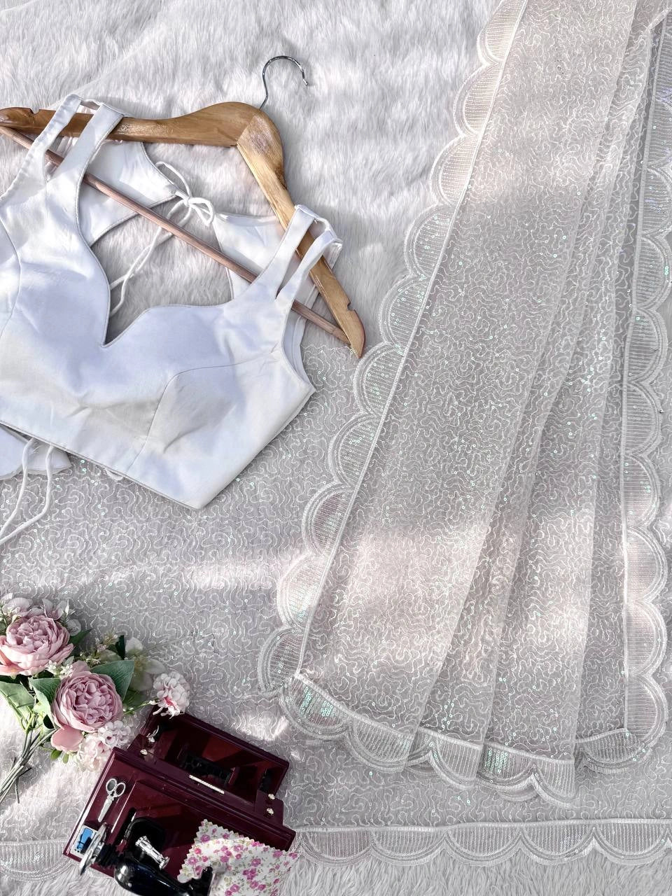 White net saree fabric and blouse piece – styled flat lay