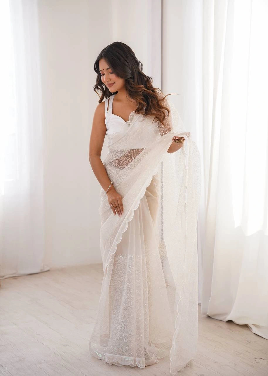 White sequins embroidered thread work soft net saree – front drape on model