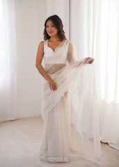 White party wear sequins saree – pleats and pallu on model
