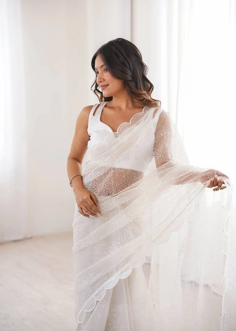 White wedding wear net saree – draped look on model