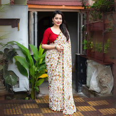 Embrace tradition with this White Warli Print Soft Georgette Saree, a stunning piece for any occasion. Crafted from lightweight soft georgette, this saree features intricate Warli prints in a classic white base, accented with vibrant multicolored patterns and a playful pom-pom border.