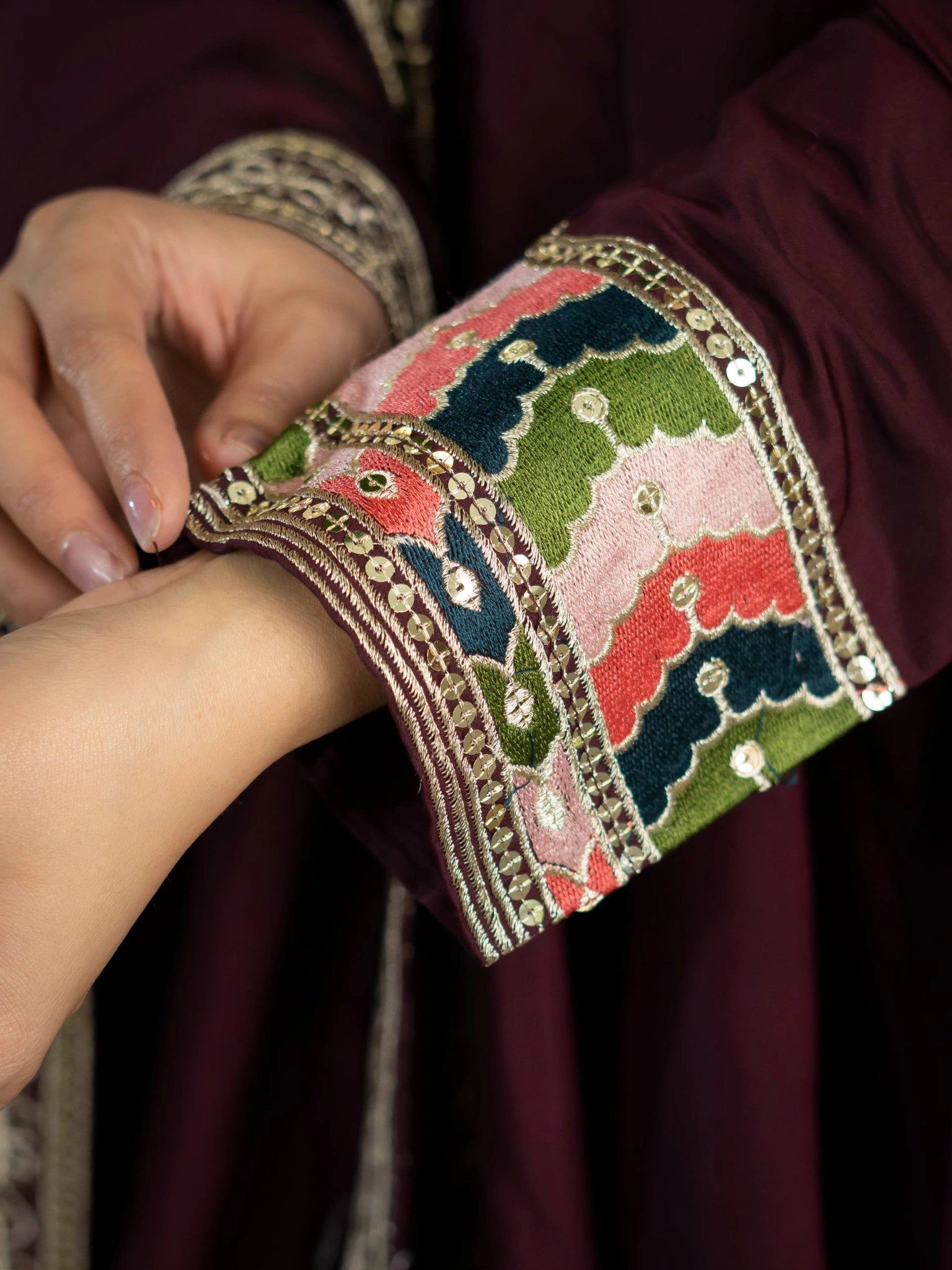 Wine Sequins Anarkali Suit extreme close up multicolor tribal cuff embroidery