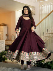 Wine Sequins Anarkali Suit twirling showing multicolor embroidered hem border