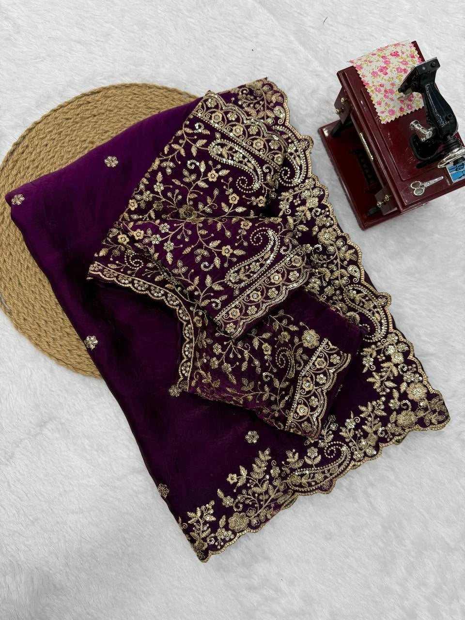 Wine saree folded with embroidered running blouse piece