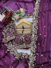 Wine saree flat lay with embroidered blouse and pallu