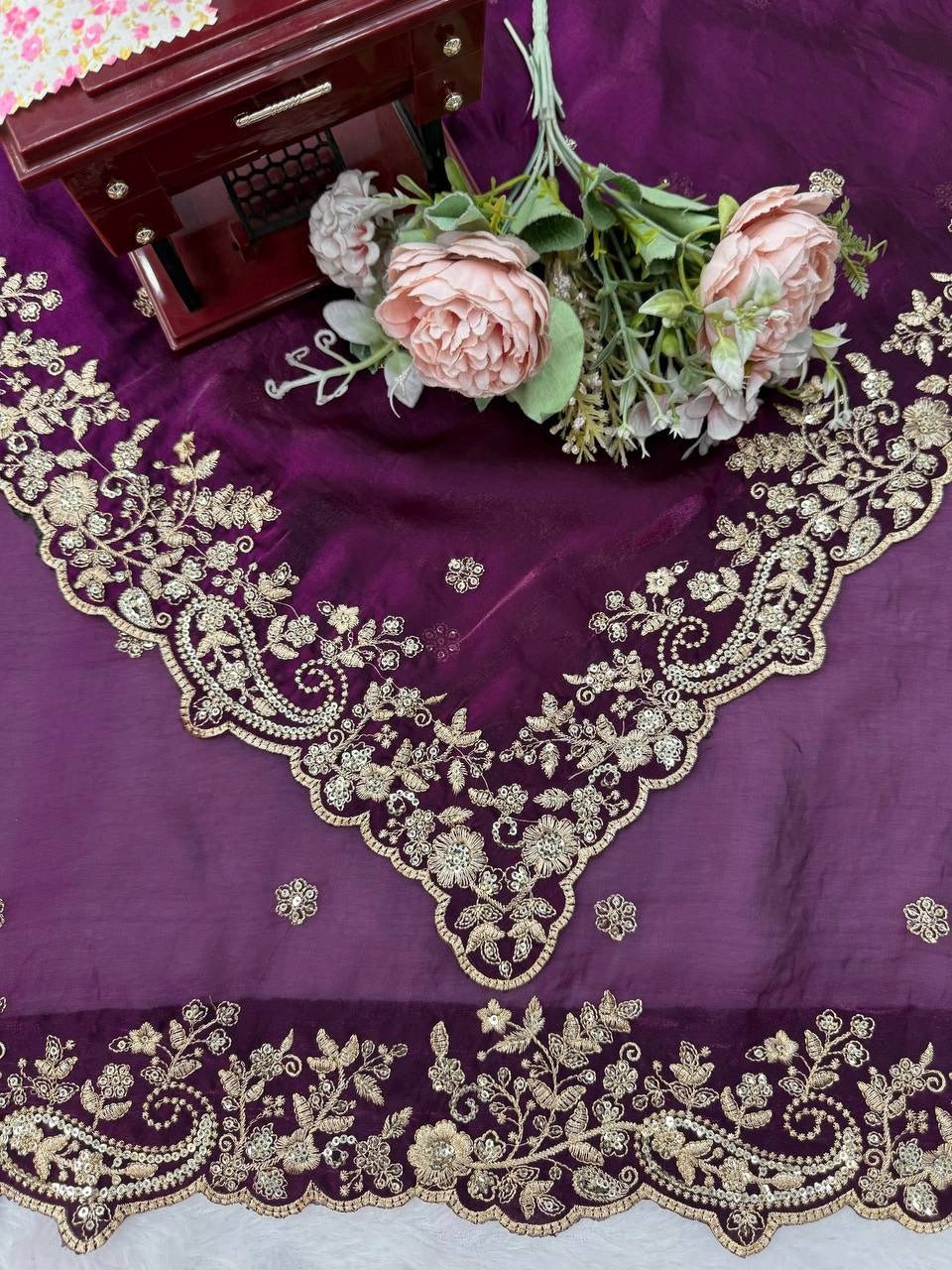 Wine saree embroidered pallu close view