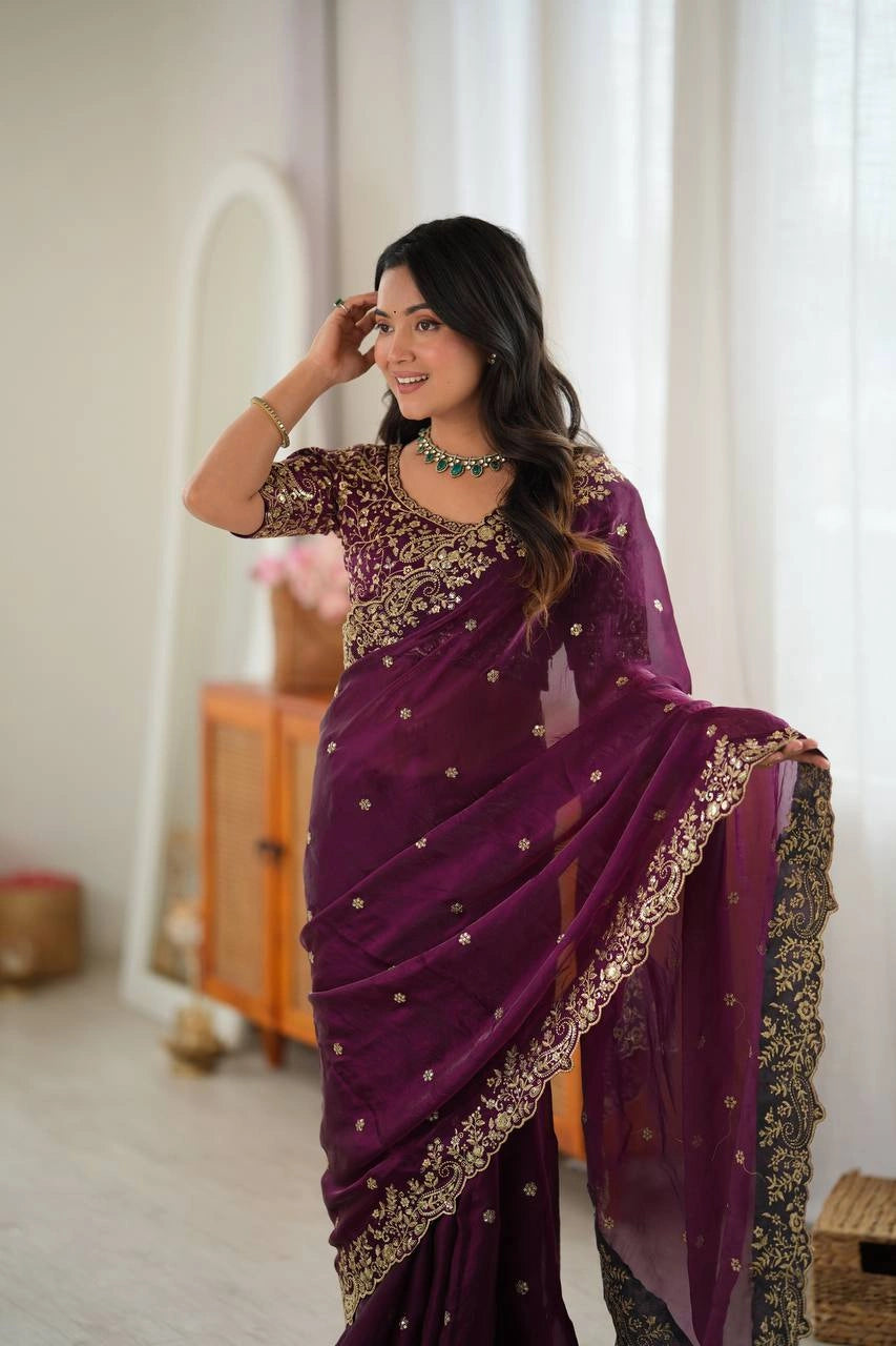 Wine saree on model showing embroidered pallu