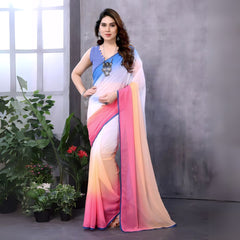 A woman models a vibrant Multicolour Georgette Silk Saree featuring a horizontal ombre color transition from blue at the top to white, pink, and peach at the bottom. The saree has a thin blue border. She pairs it with a light blue sleeveless blouse and a chunky blue and silver necklace.