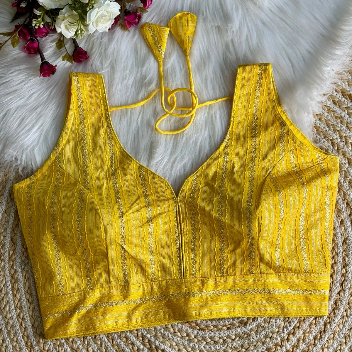 Elegant Yellow Zari Work Blouse Top crafted from silk fabric, featuring intricate embroidery patterns, perfect for festive and traditional occasions.