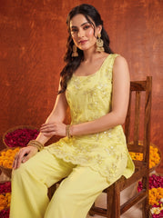Yellow Suit KU318 seated on chair