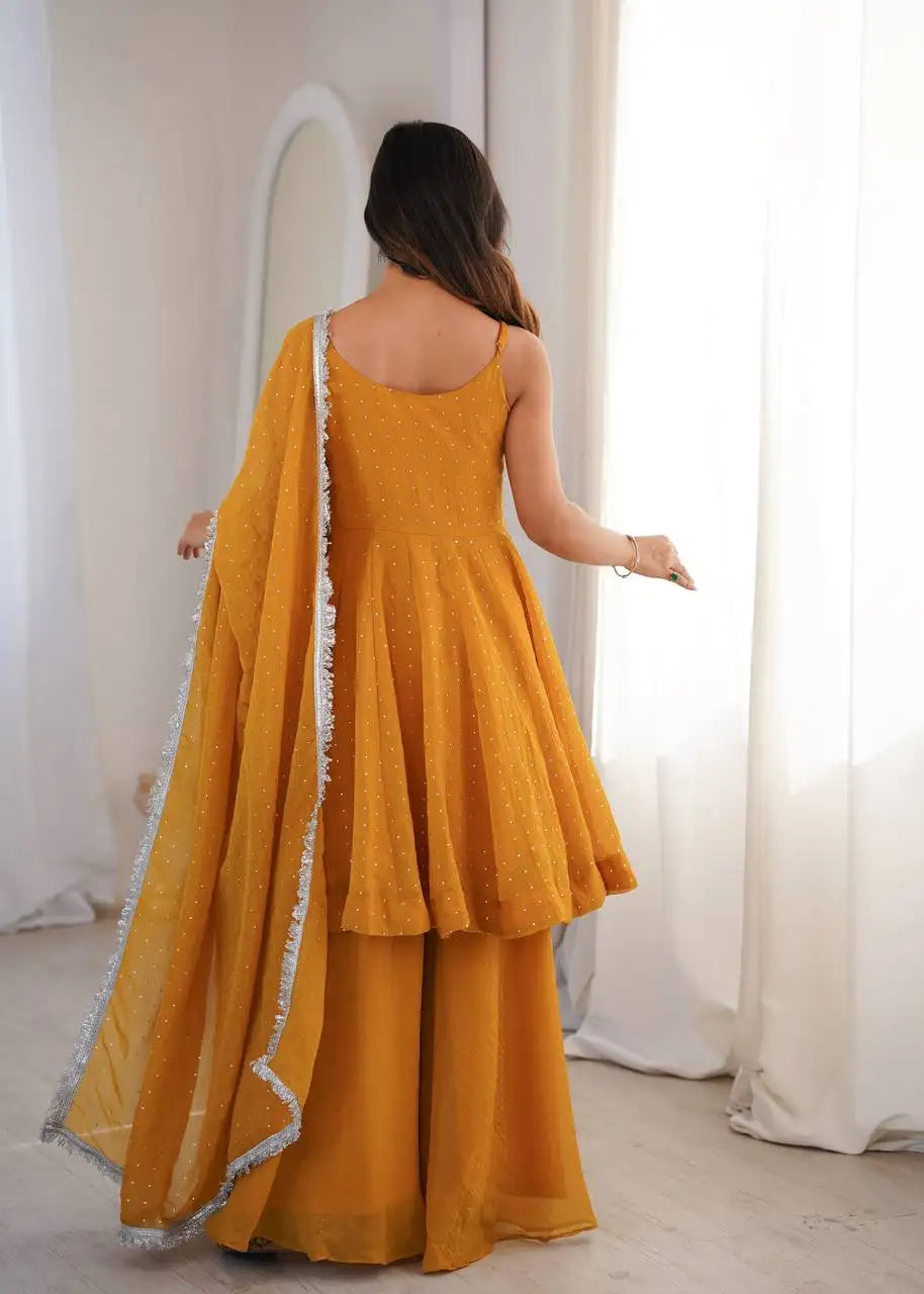 Yellow Jharkhand Work Suit KU257 model holding dupatta lace border