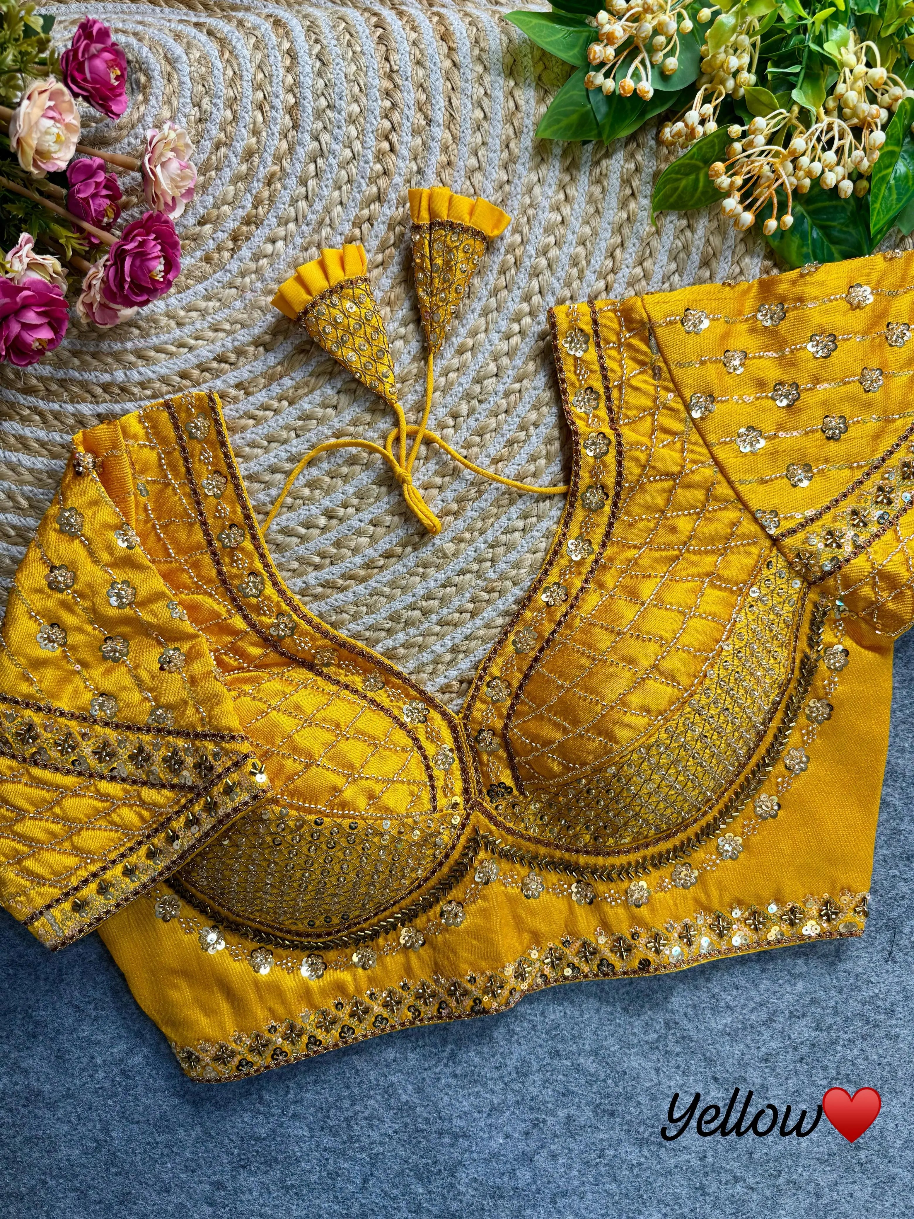 Yellow blouse crafted from soft silk fabric, featuring intricate sequence and codding thread work.
