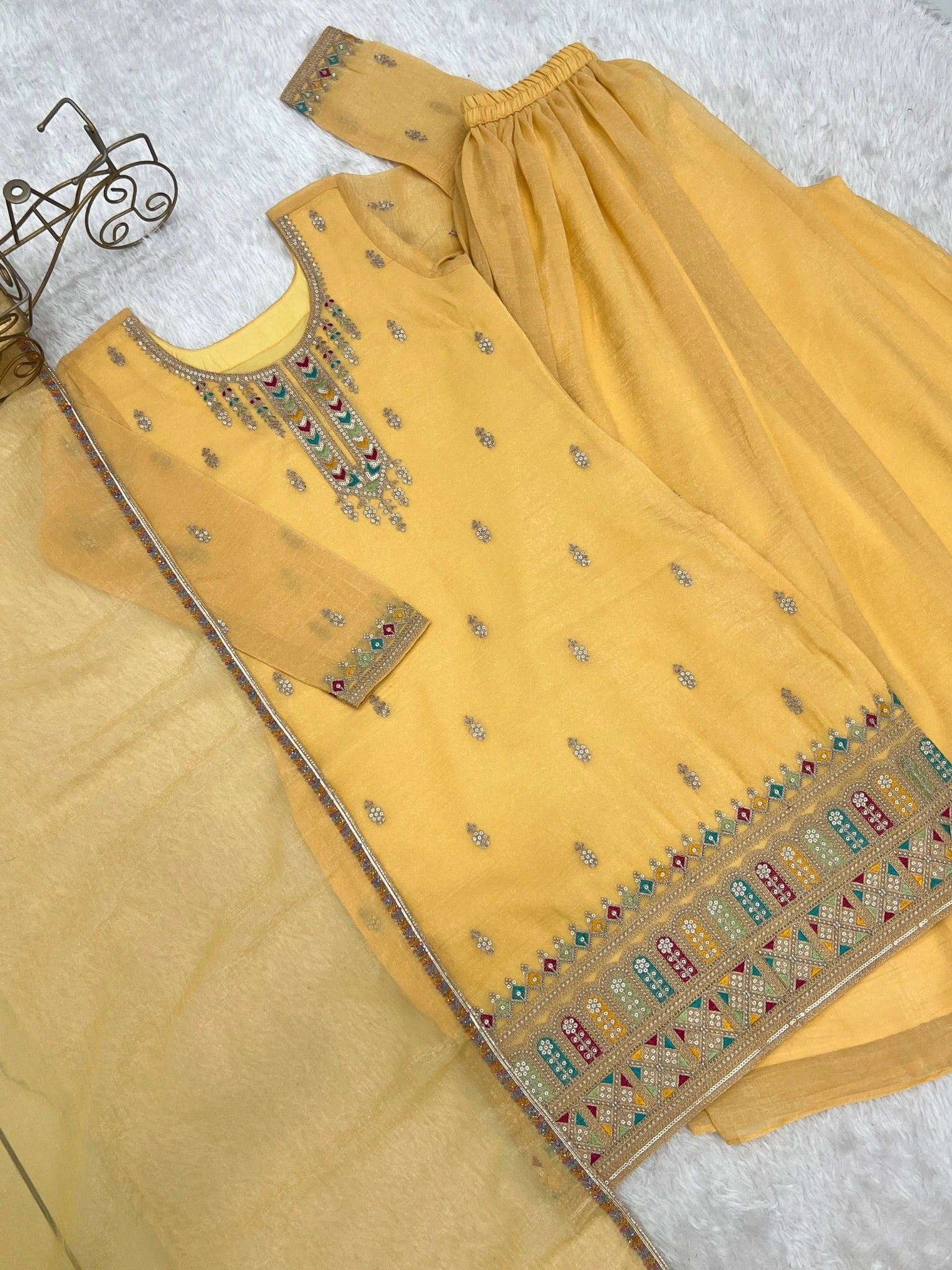 Yellow Sequins Embroidered Suit kurta and sharara flat lay