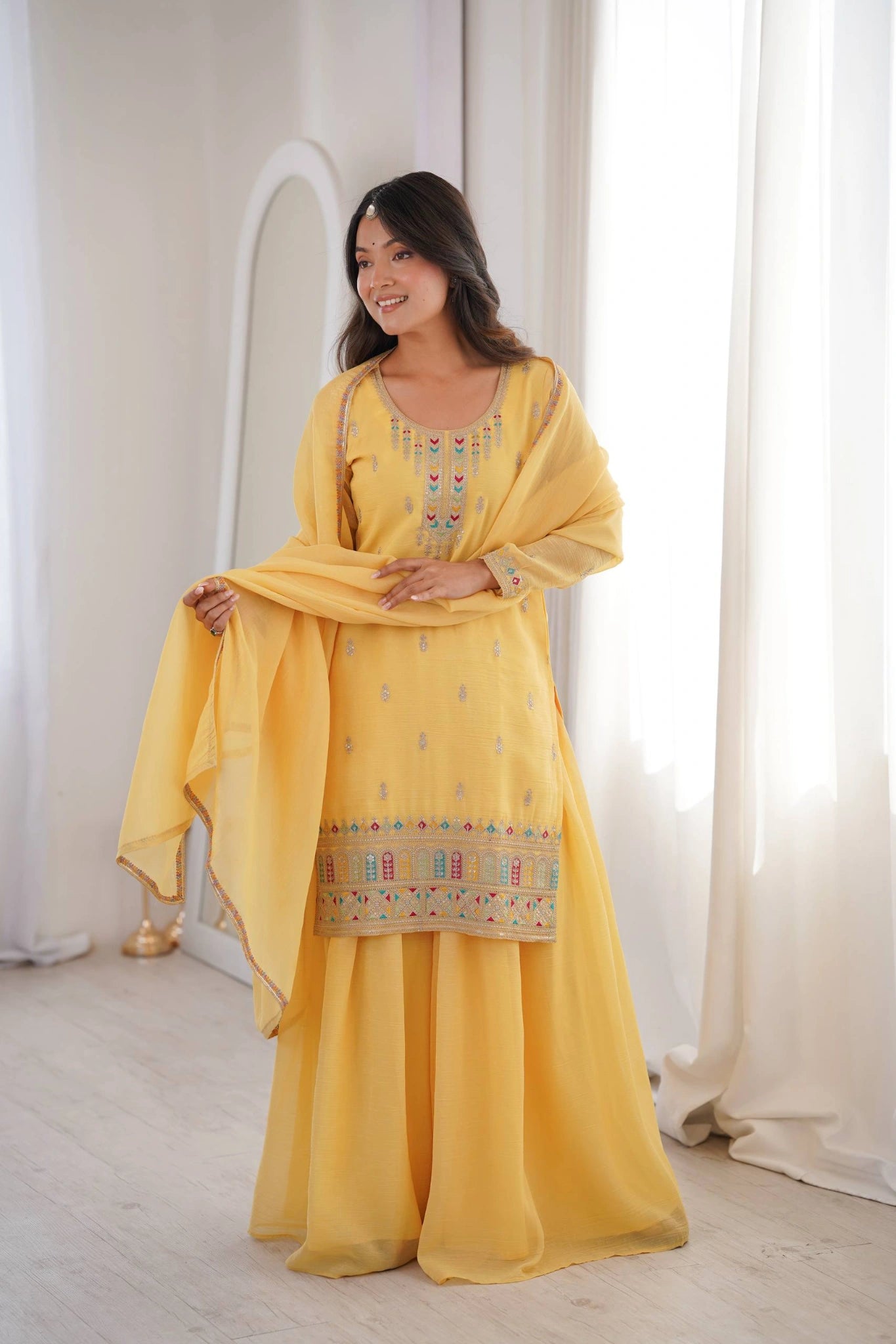 Yellow crunchy silk sharara suit with lace border dupatta