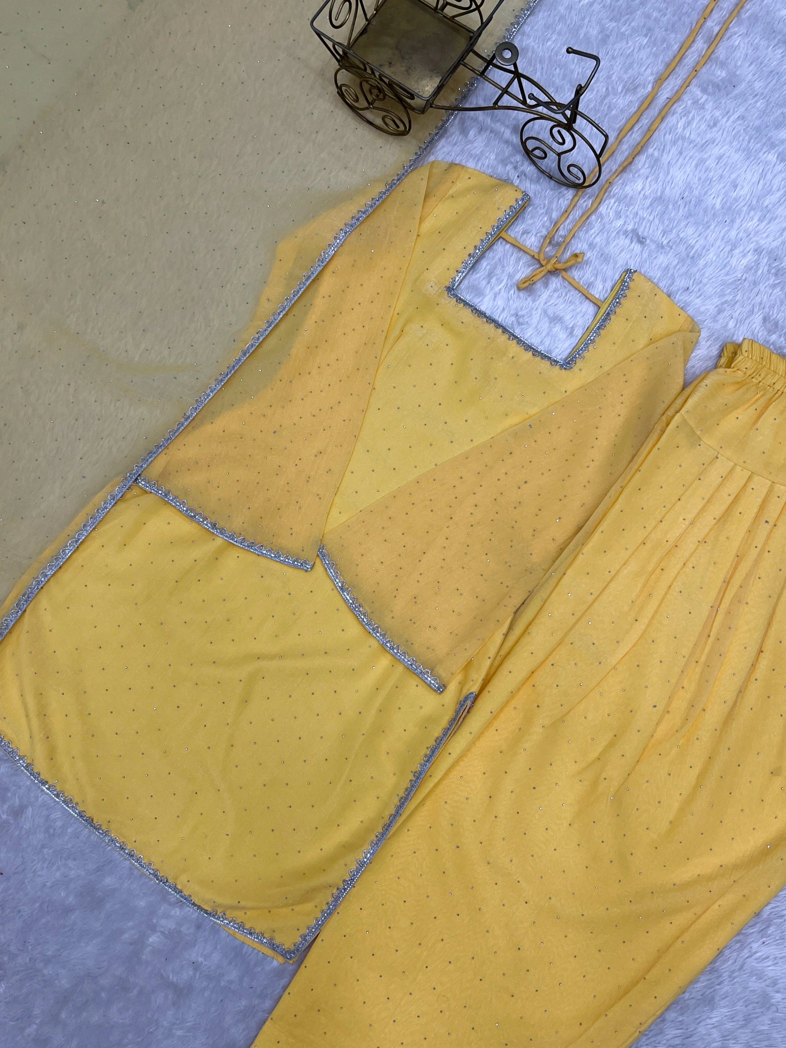 Yellow suit flat lay - kurta, shalwar and dupatta